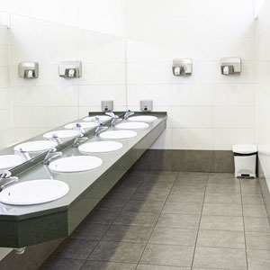 A row of sinks in a public restroom, providing a convenient and hygienic space for individuals to wash their hands- Moss Bollinger LLP