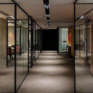 A sleek hallway with transparent walls- Moss Bollinger LLP