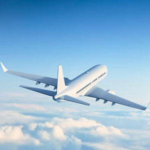 A white airplane soaring through the sky, showcasing its elegance and grace- Moss Bollinger LLP