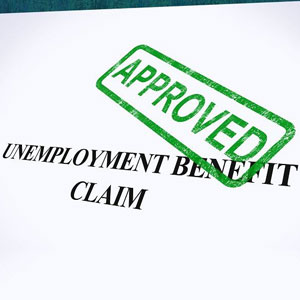 A document with a stamp of approval, signifying the successful approval of an unemployment benefits claim- Moss Bollinger LLP