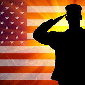 Silhouetted figure salutes against vibrant American flag, creating a powerful image of universal respect and honor. 🇺🇸- Moss Bollinger LLP