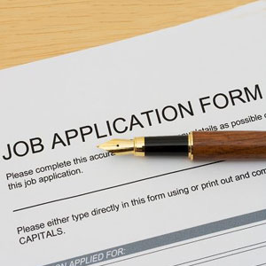 Right to Privacy Regarding SalaryA job application form with a wooden pen on it- Moss Bollinger LLP
