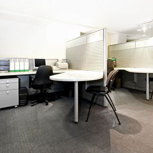 An office with two desks and chairs, providing a professional workspace- Moss Bollinger LLP