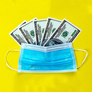 A blue face mask cradles several one hundred dollar bills against a bright yellow background- Moss Bollinger LLP