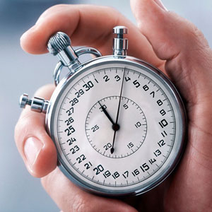 A silver stopwatch with precise time indicators, held by a hand- Moss Bollinger LLP