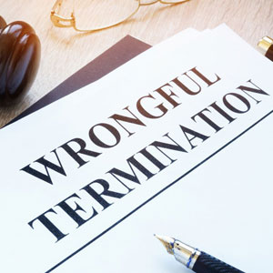 A legal document titled “WRONGFUL TERMINATION” with a pen and gavel- Moss Bollinger LLP