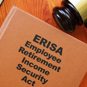 Brown book titled 'ERISA Employee Retirement Income Security Act' beside a wooden gavel on a desk- Moss Bollinger LLP