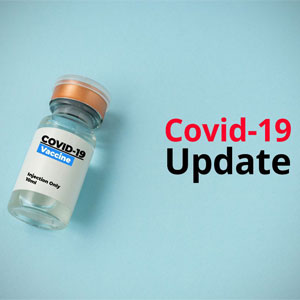COVID-19 vaccine vial with orange cap on blue background- Moss Bollinger LLP