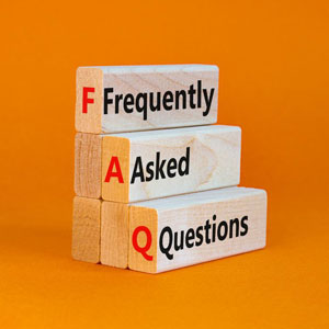 Three wooden blocks stacked against an orange background spell out the acronym “FAQ”- Moss Bollinger LLP