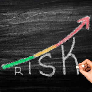 Image of Risk concept written on a blackboard - Moss Bollinger LLP