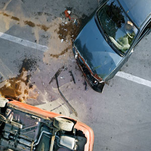 Damaged car after collision, viewed from above - Moss Bollinger LLP