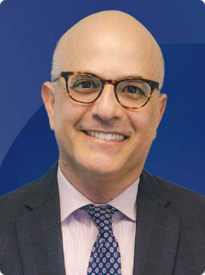 A bald man in a suit wearing glasses - Moss Bollinger LLP