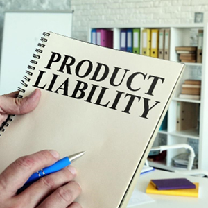 A person holding a notebook with the word product liability written on the cover. - Moss Bollinger LLP